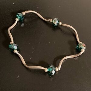 Dainty green and silver tone bracelet.